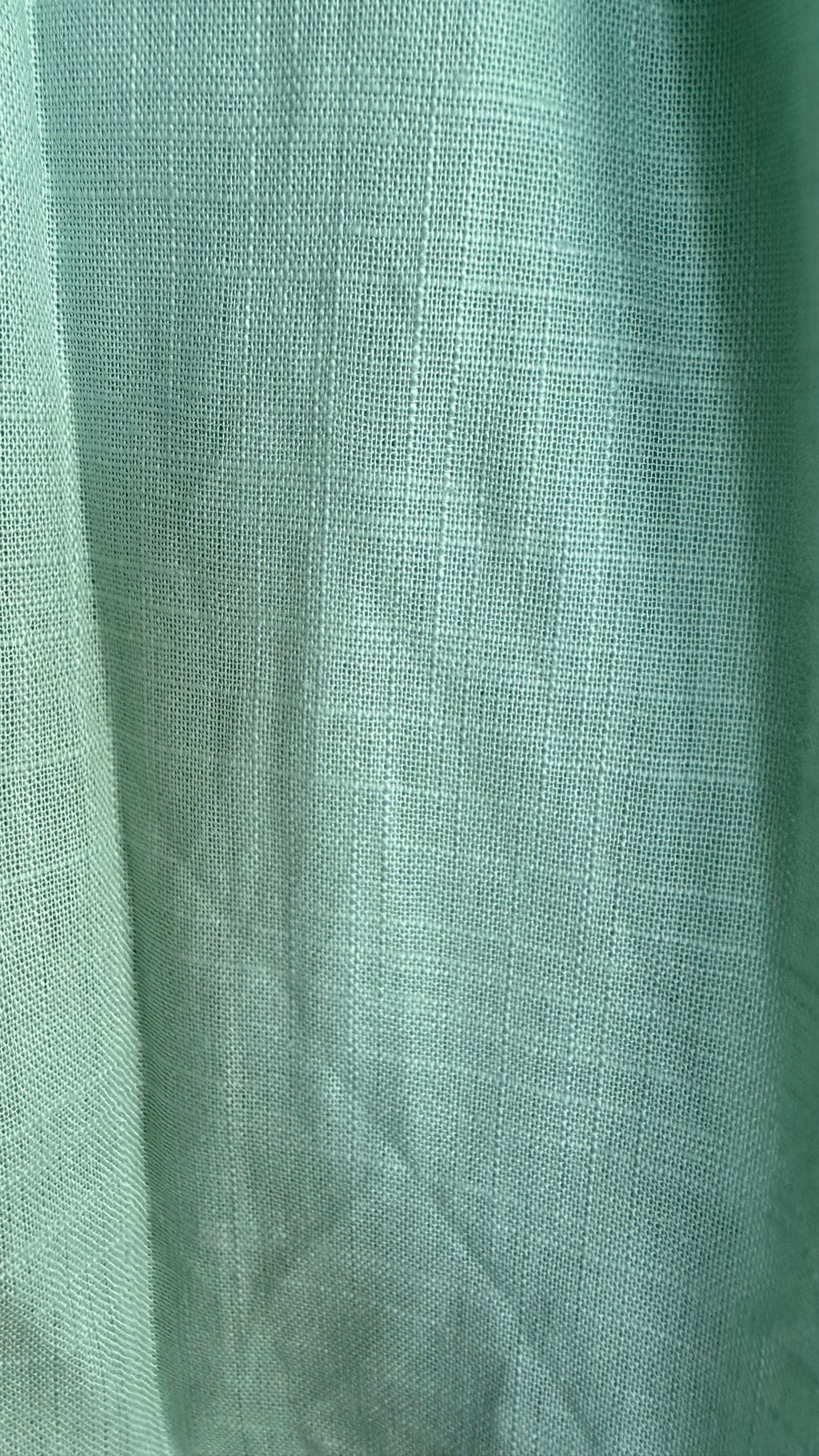 Close-up of green fabric with a textured pattern