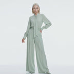 Woman showcasing Tie-Neck Wide-Leg Jumpsuit